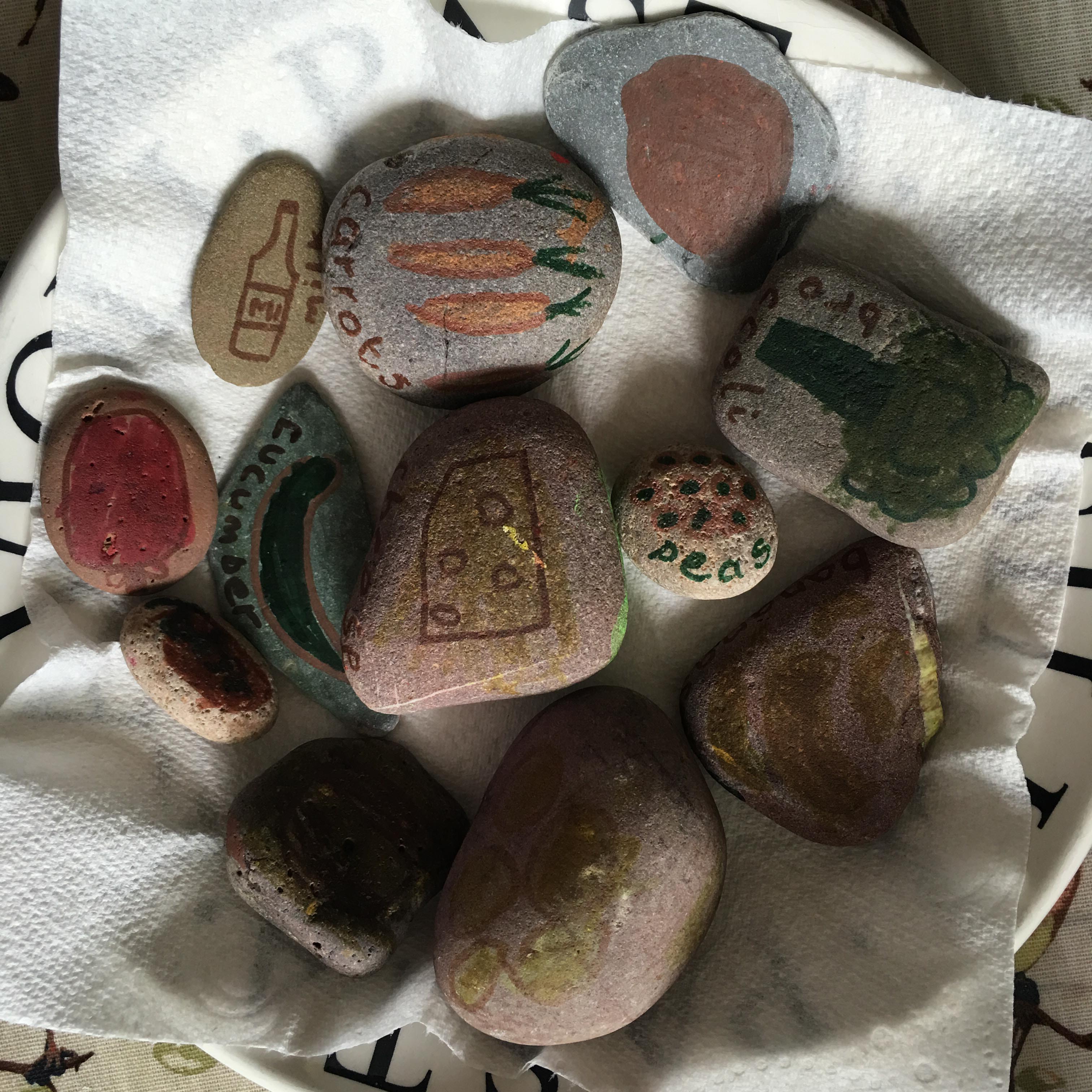 making simple mud kitchen food with stones for creative play