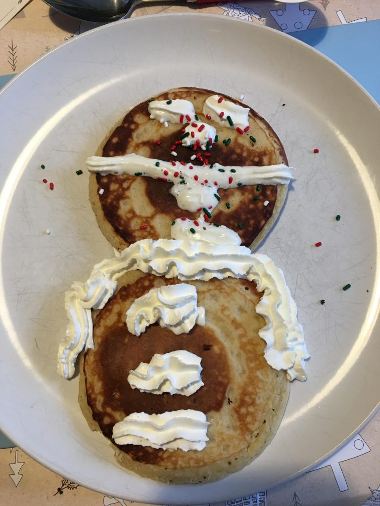 Small pancakes which can be decorated with cream to look like snowmen