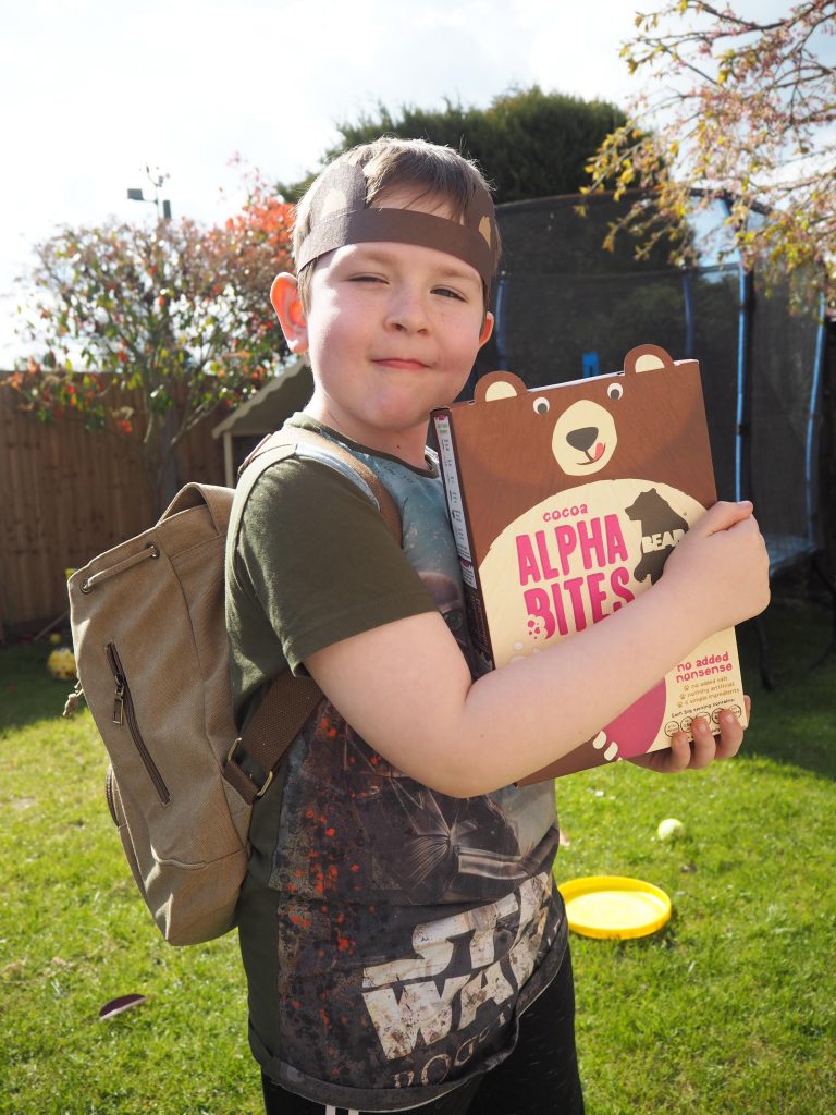 Boy with box of BEAR Alphabites