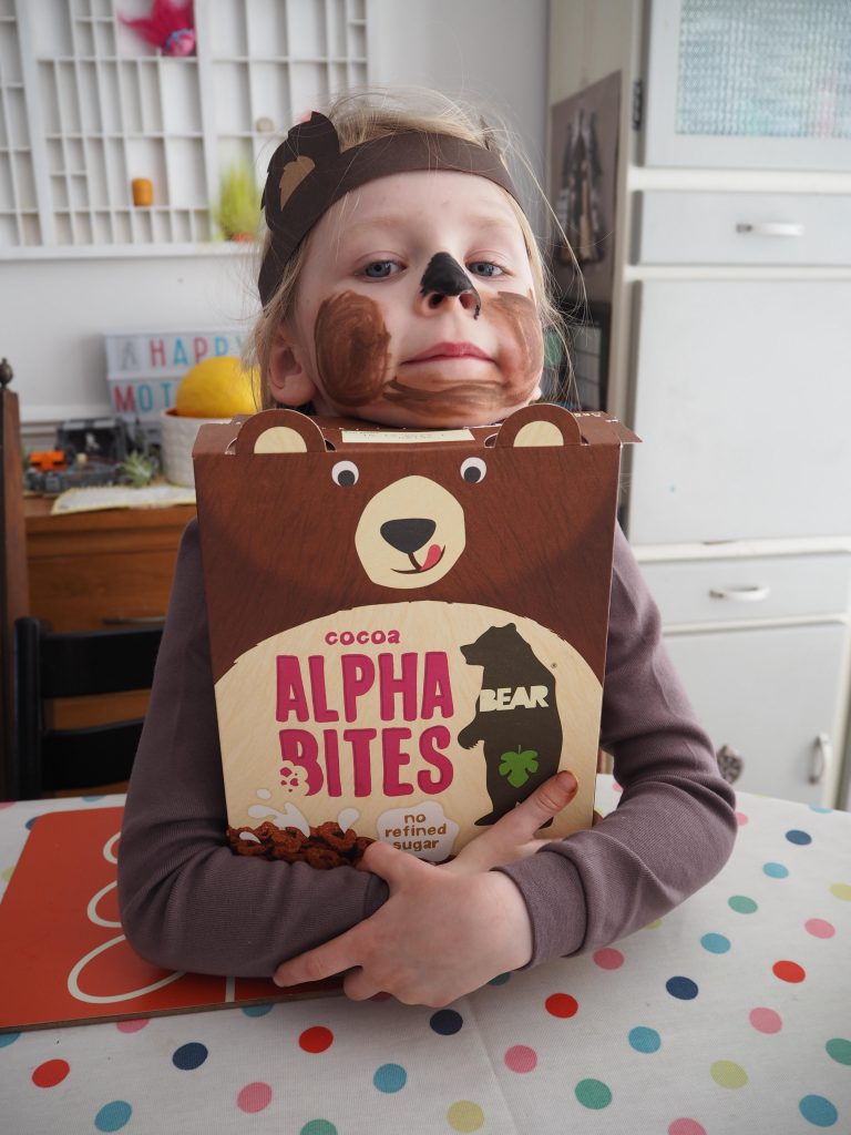 girl hugging a box of BEAR Alphabites