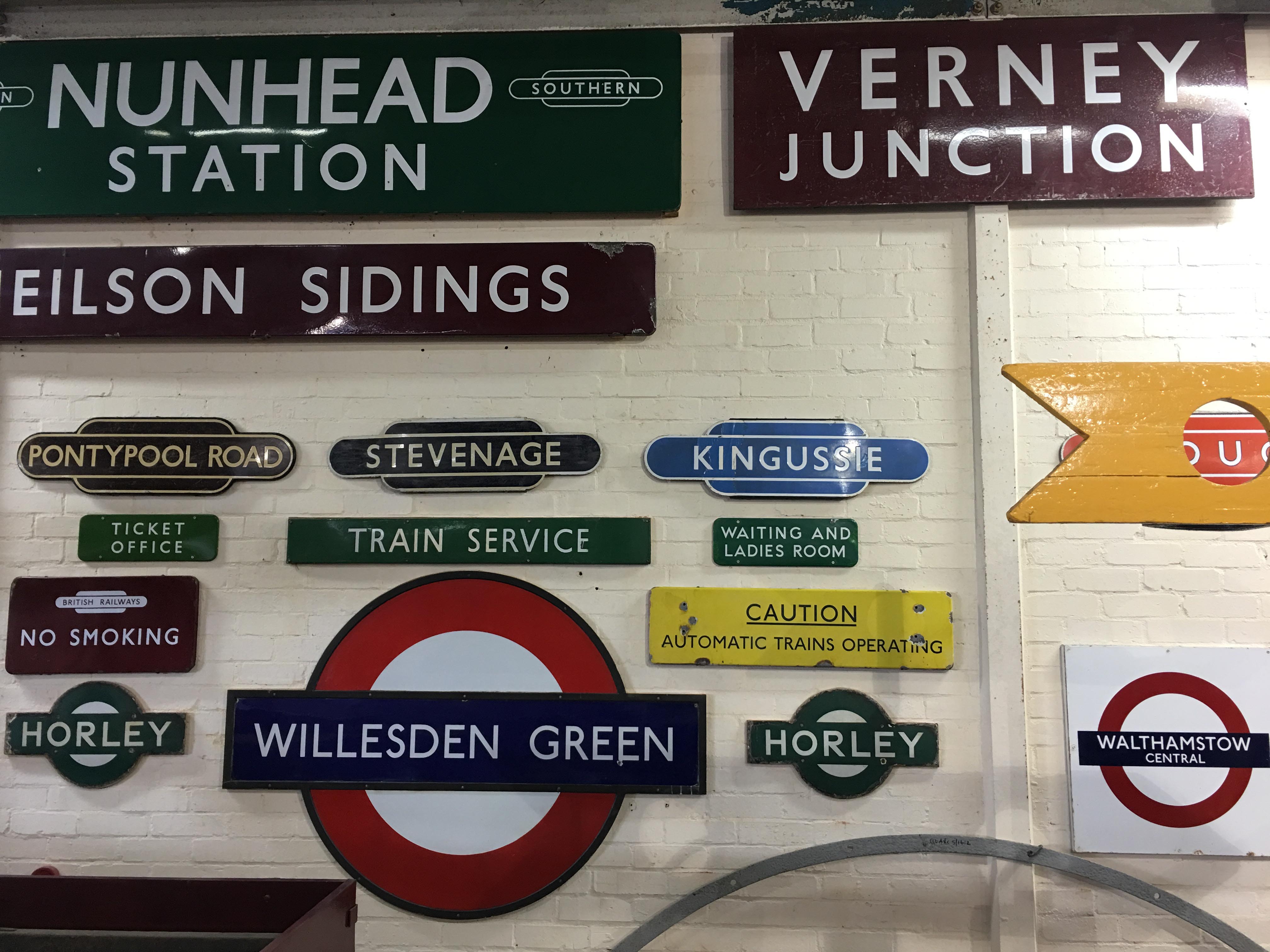 wall of vintage signs at Buckinghamshire Railway Centre