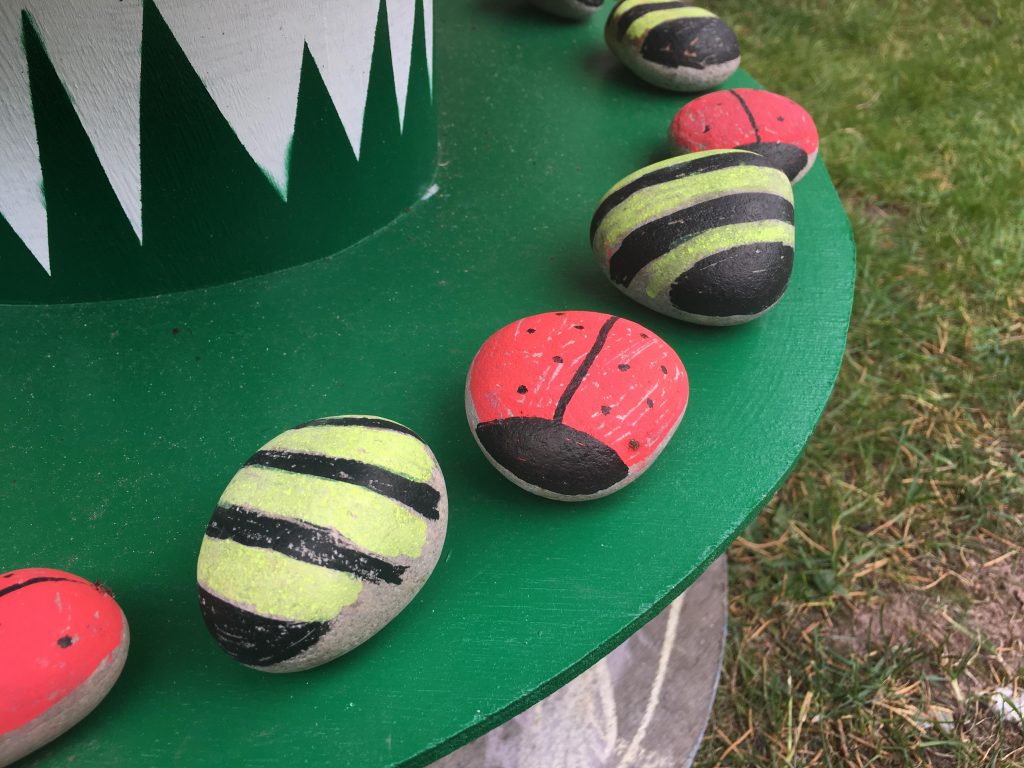 painted stone ladybirds and bees