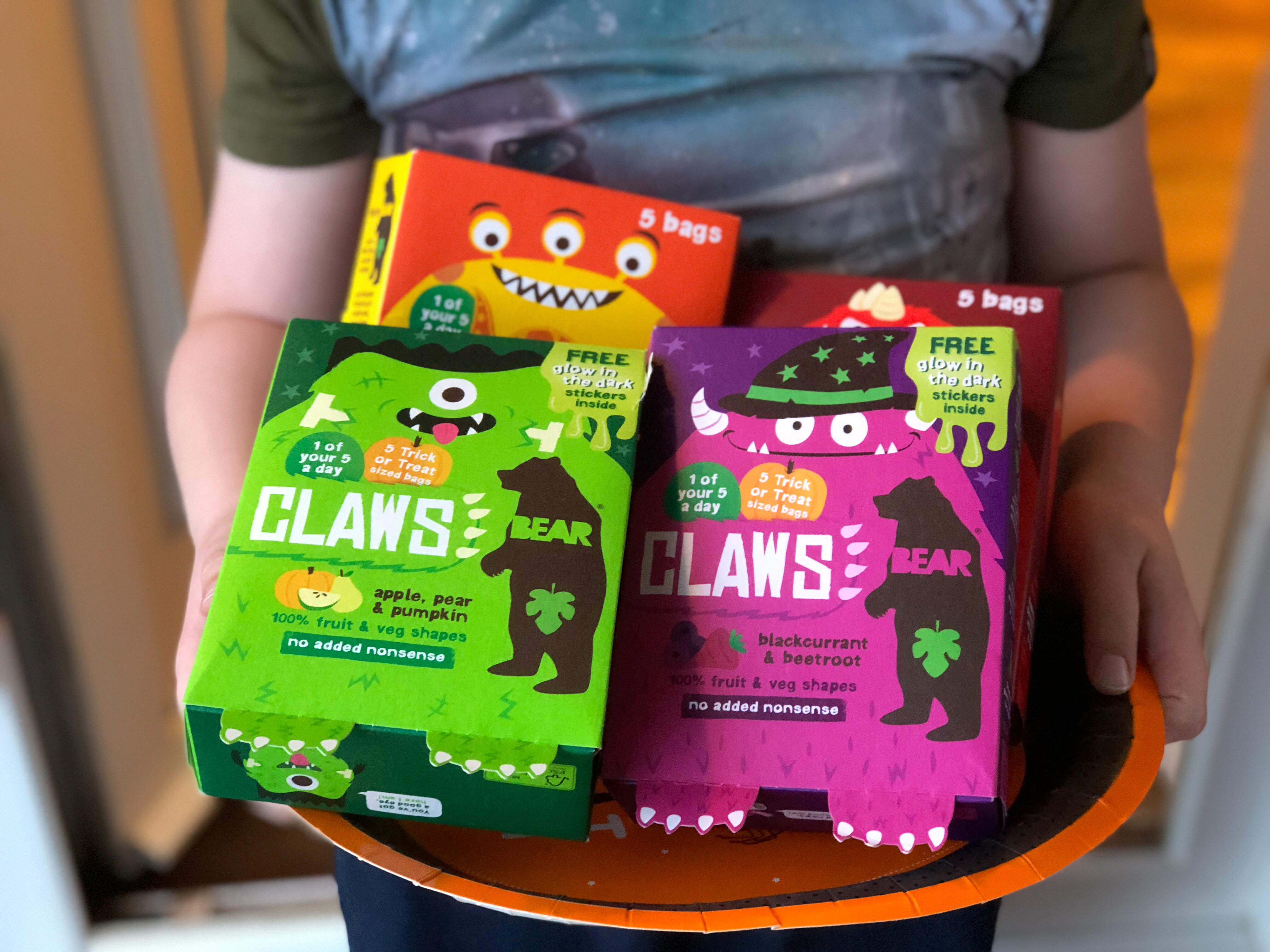 boy holding plate of Limited edition BEAR Claws