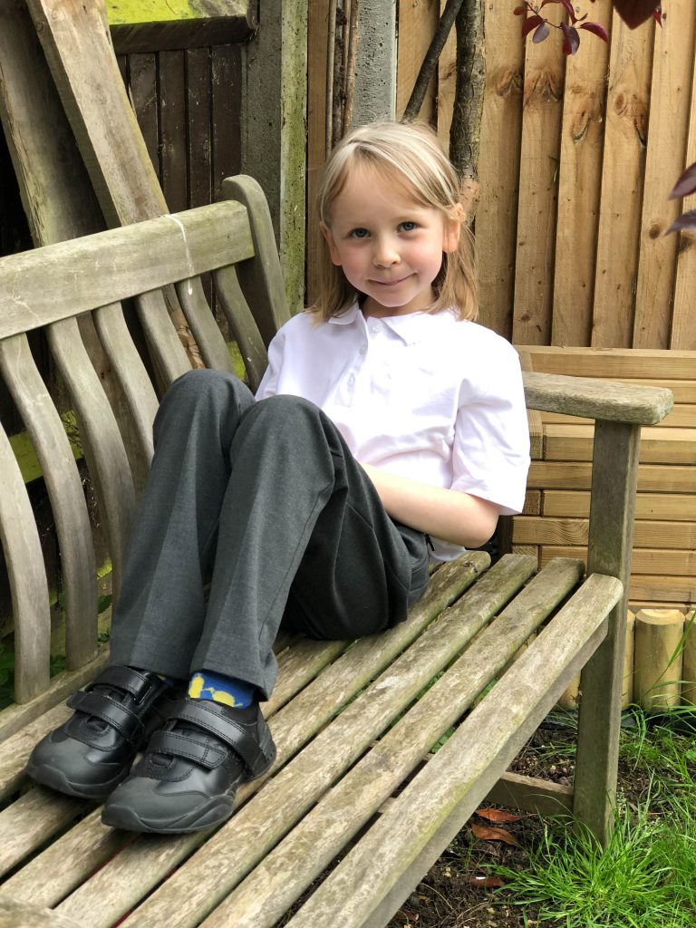 girl wearing new M&S uniform for September