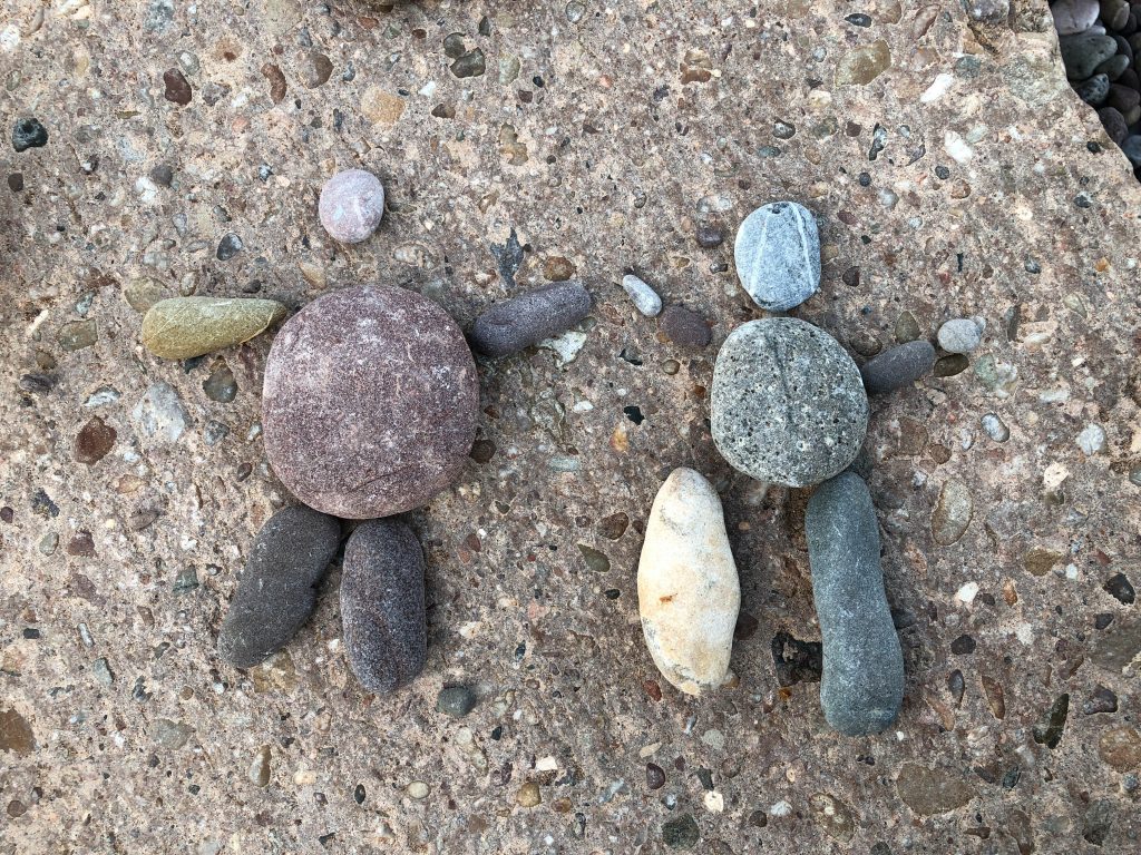 making people out of pebbles at the beach