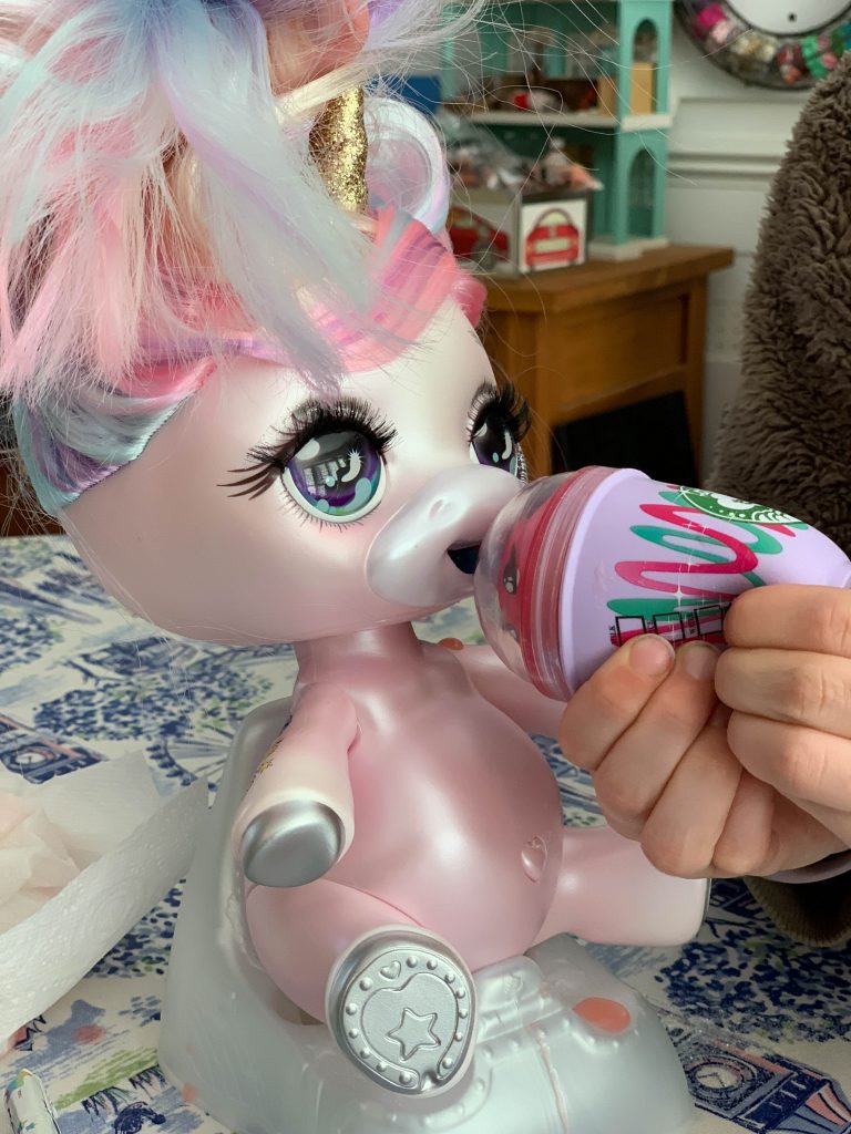 making slime in the Poopsie Unicorn Slime Surprise