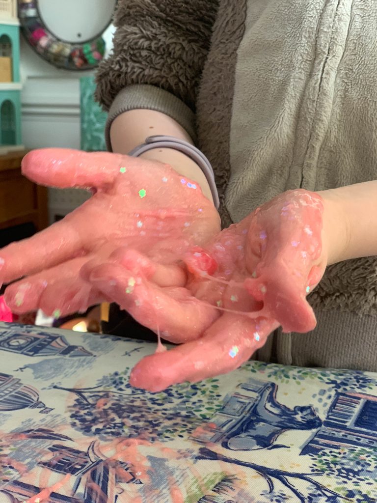 making slime in the Poopsie Unicorn Slime Surprise