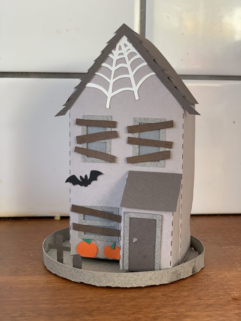 making a spooky papercut house for Halloween