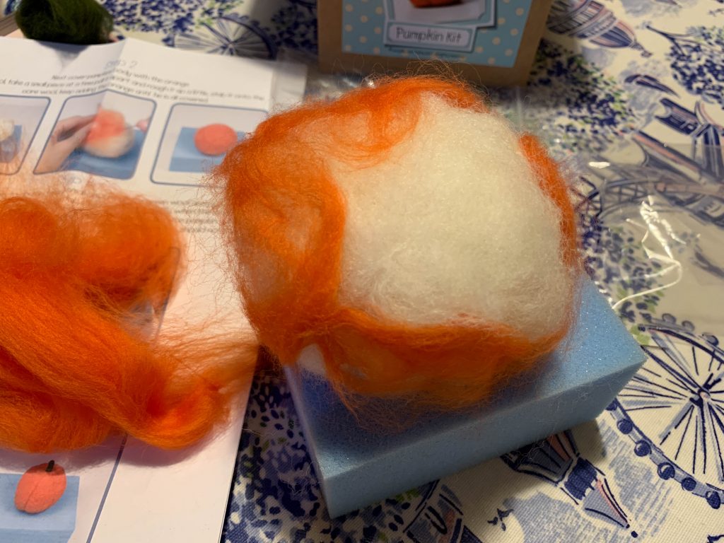 needle felting a pumpkin