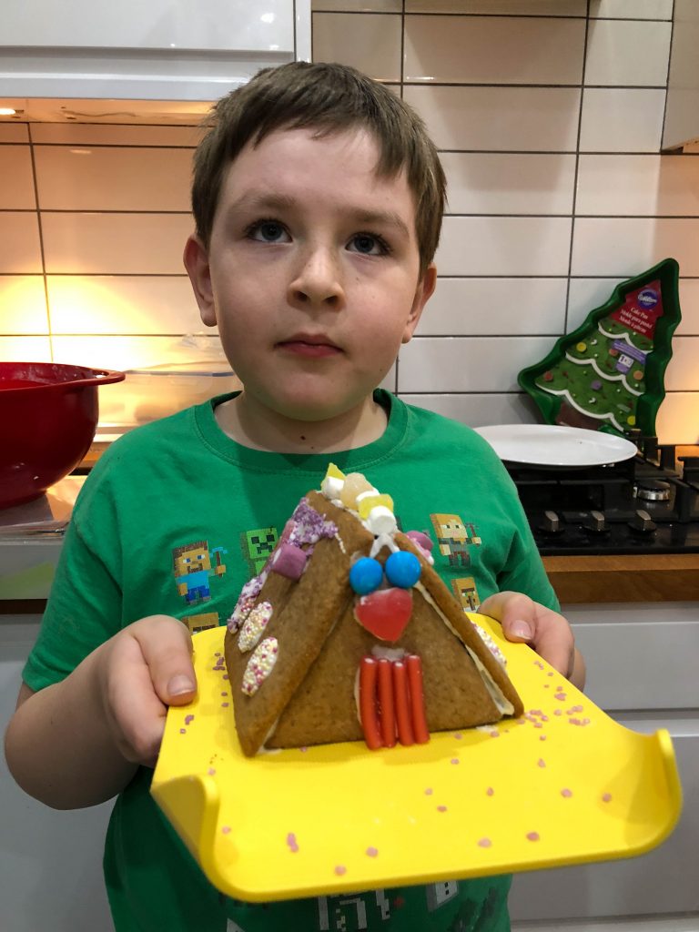 decorating a gingerbread house