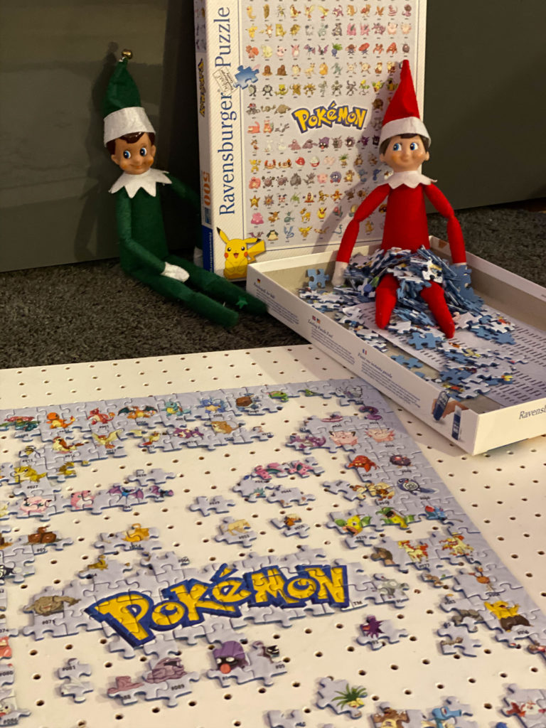 Elf on the Shelf doing a jigsaw