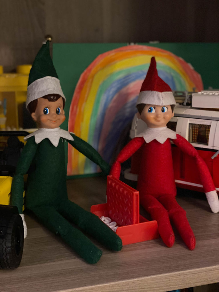 Elf on the Shelf playing connect 4 