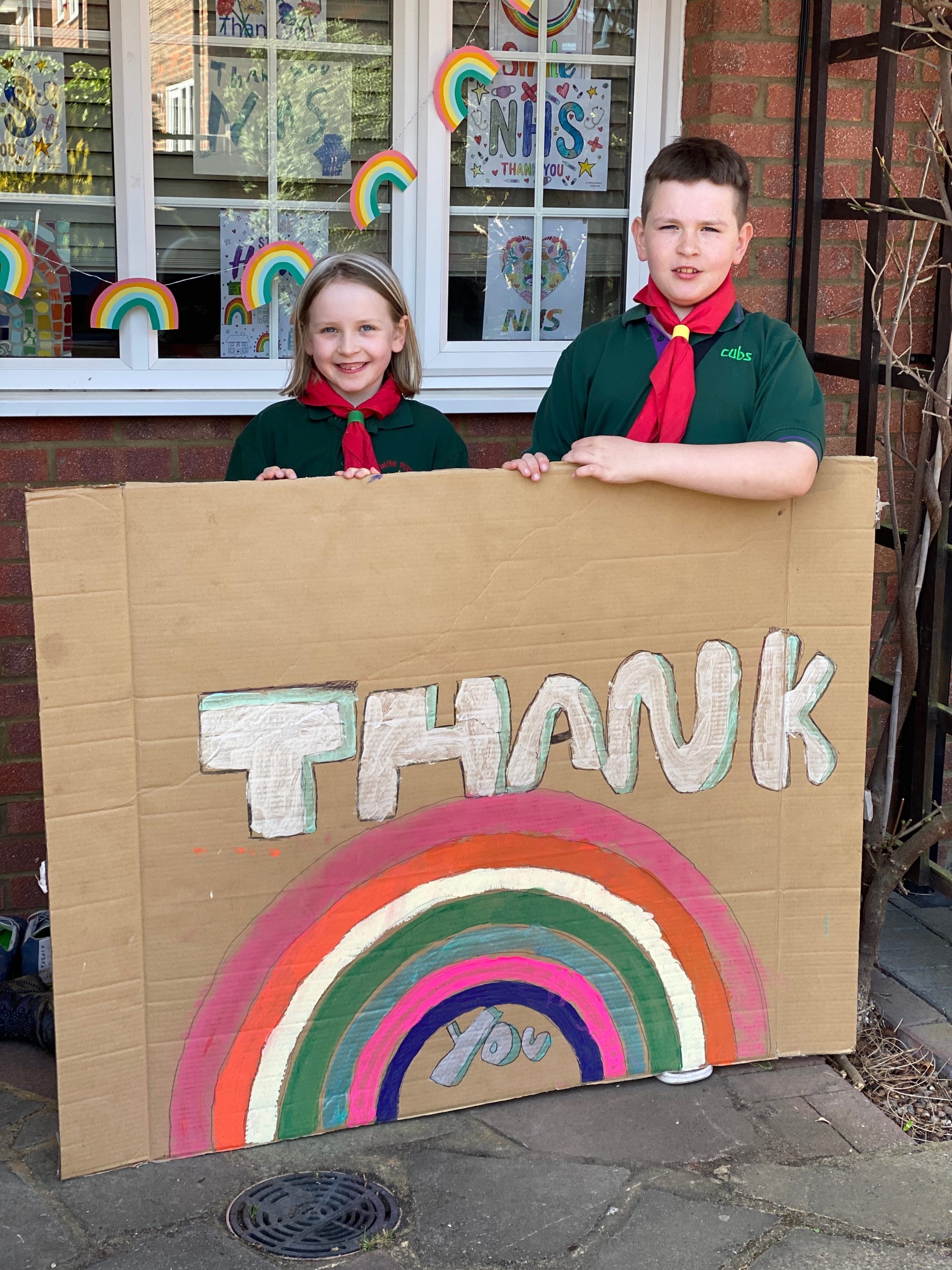 Cub Scouts with their Thank the NHS Sign