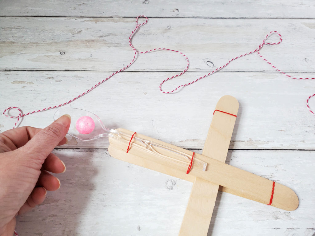 Coat hanger catapult STEM craft for kids - The Craft Train